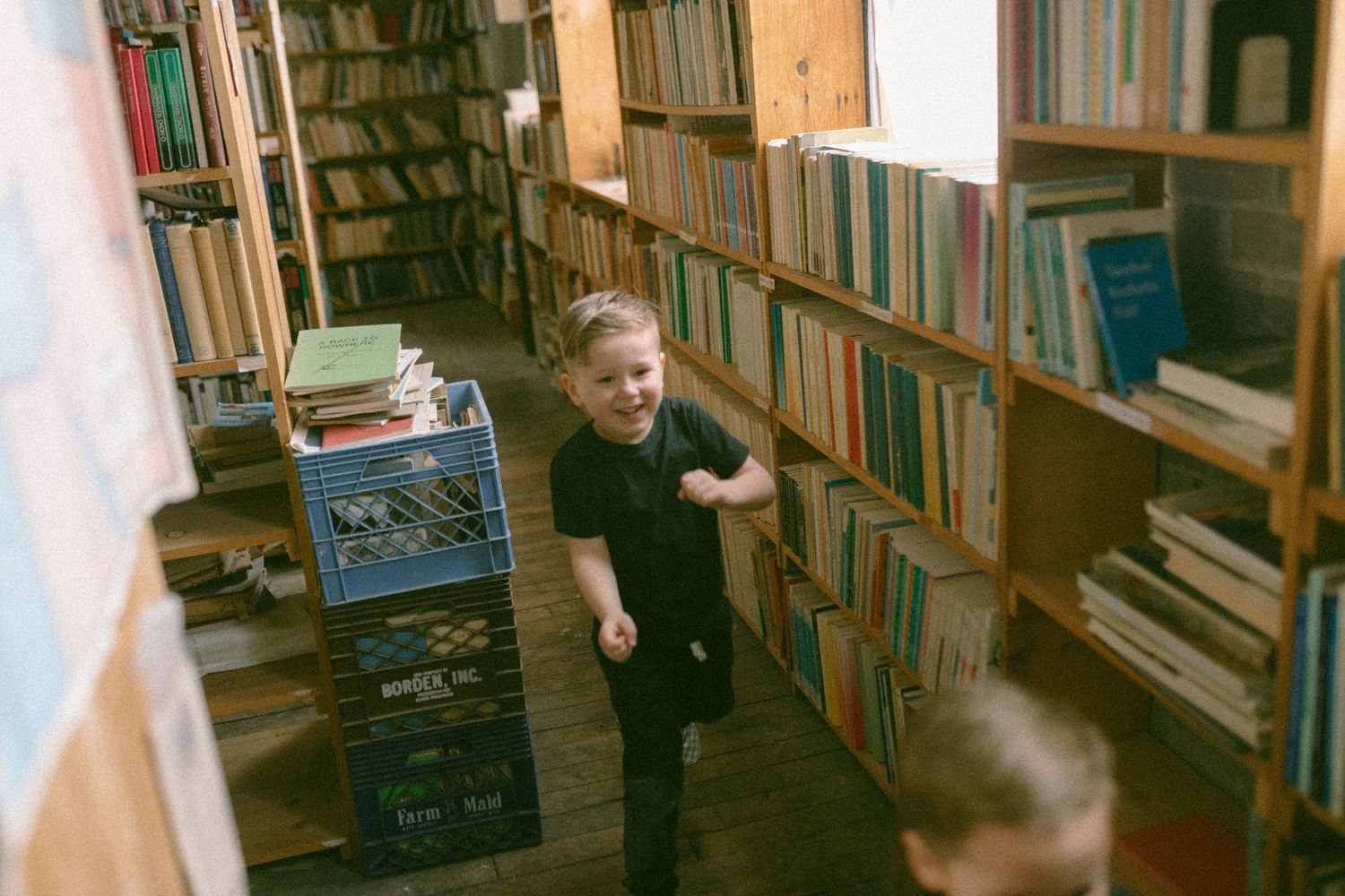 untraditional, unique family photos taken in a bookstore in downtown detroit