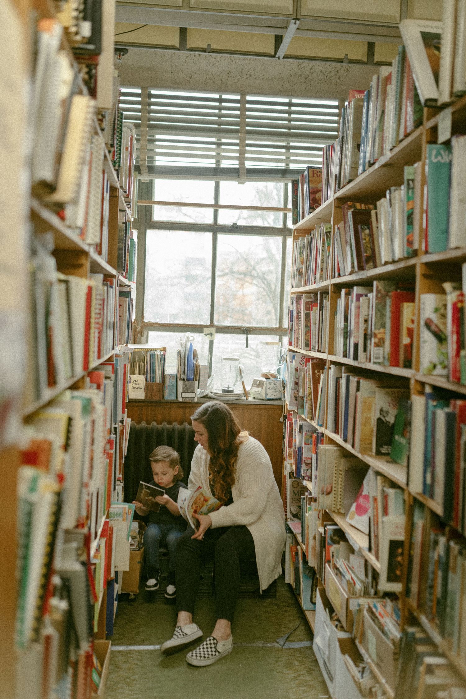 untraditional, unique family photos taken in a bookstore in downtown detroit