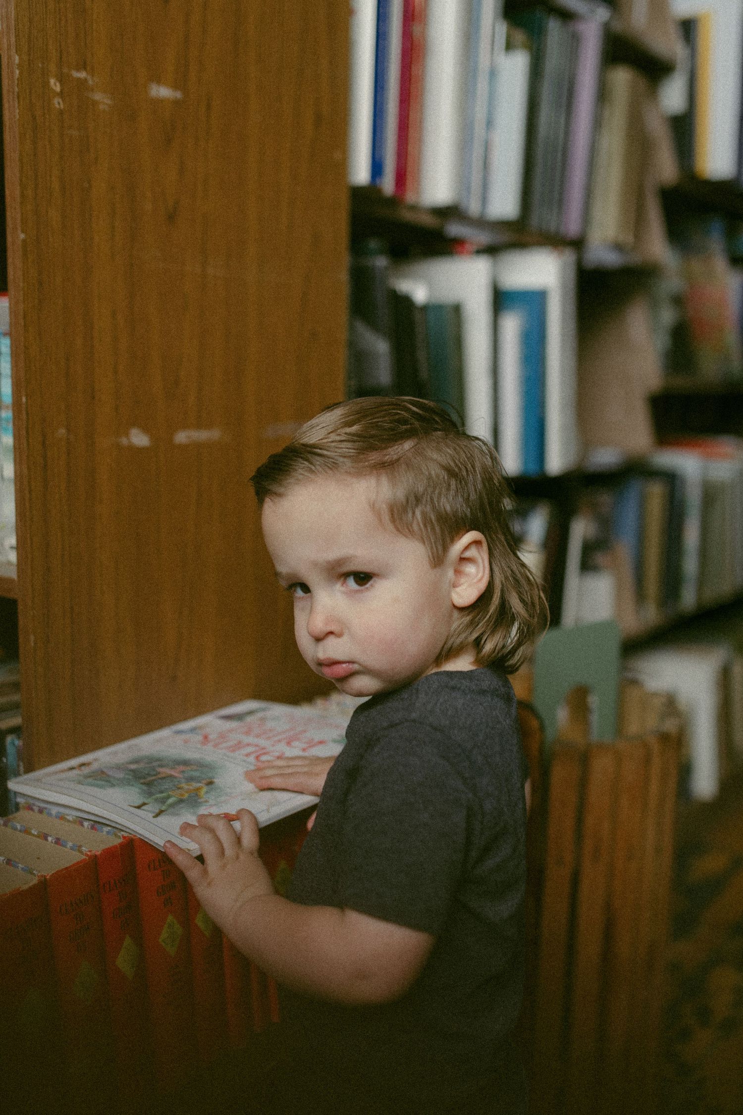 untraditional, unique family photos taken in a bookstore in downtown detroit