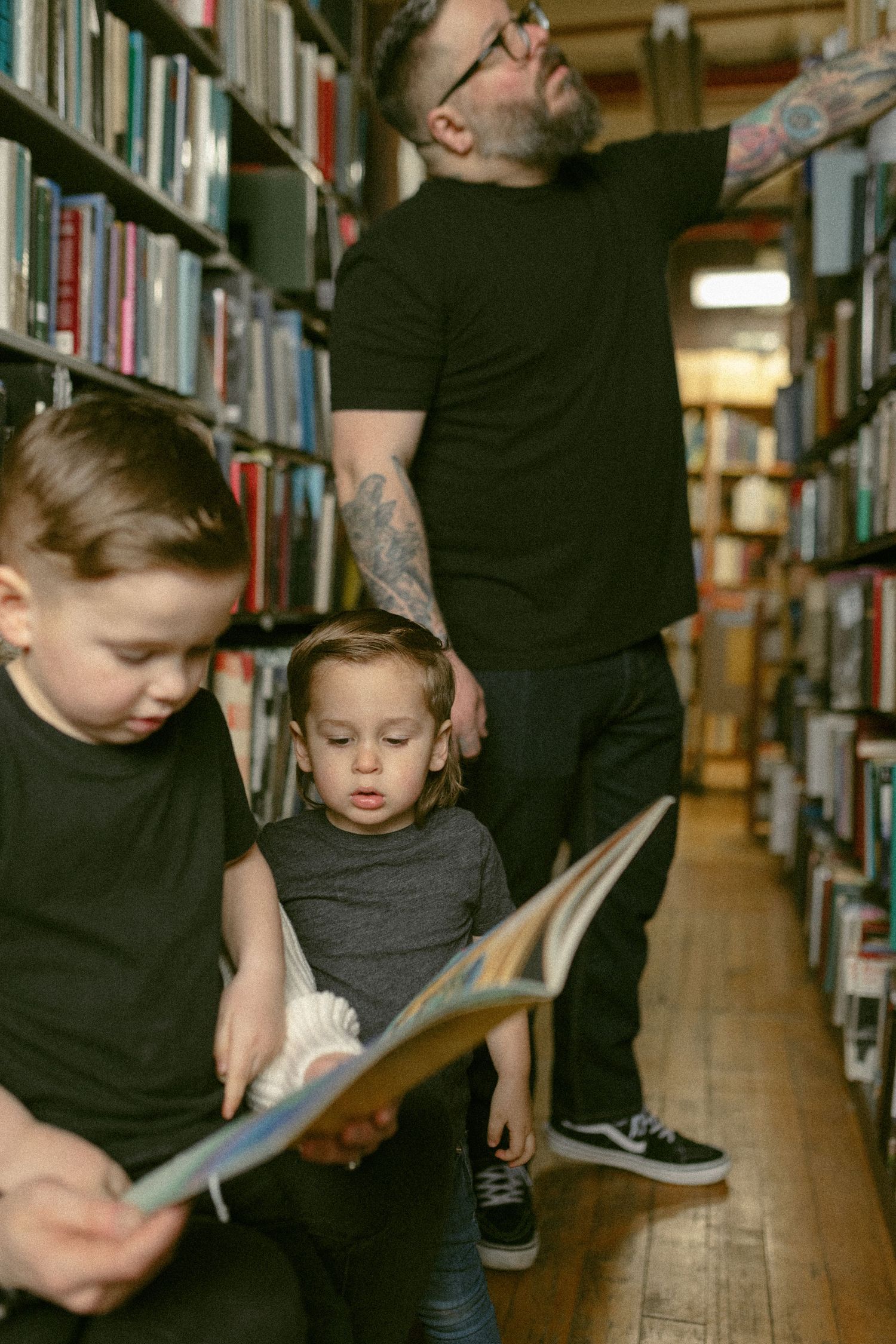 untraditional, unique family photos taken in a bookstore in downtown detroit