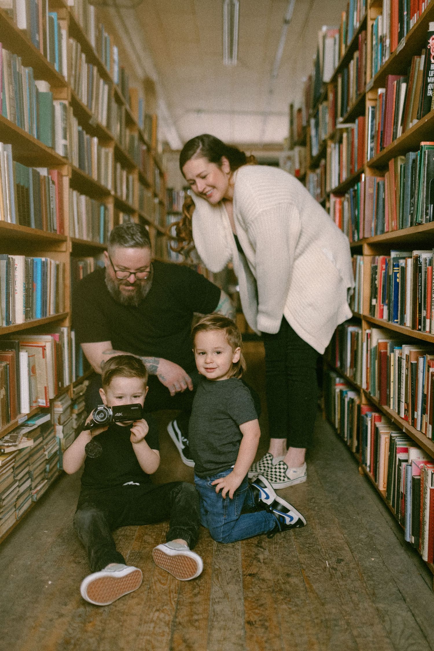 untraditional, unique family photos taken in a bookstore in downtown detroit