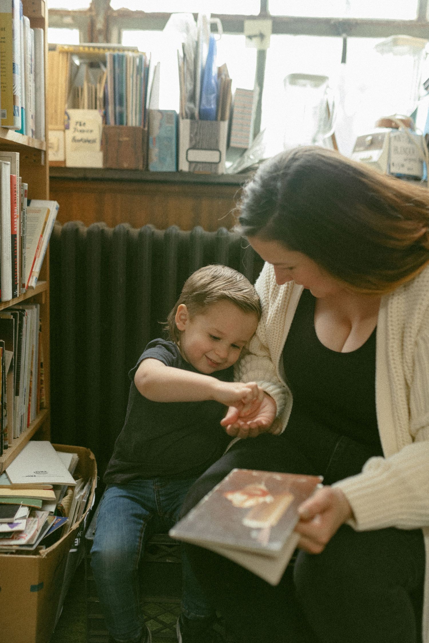 untraditional, unique family photos taken in a bookstore in downtown detroit