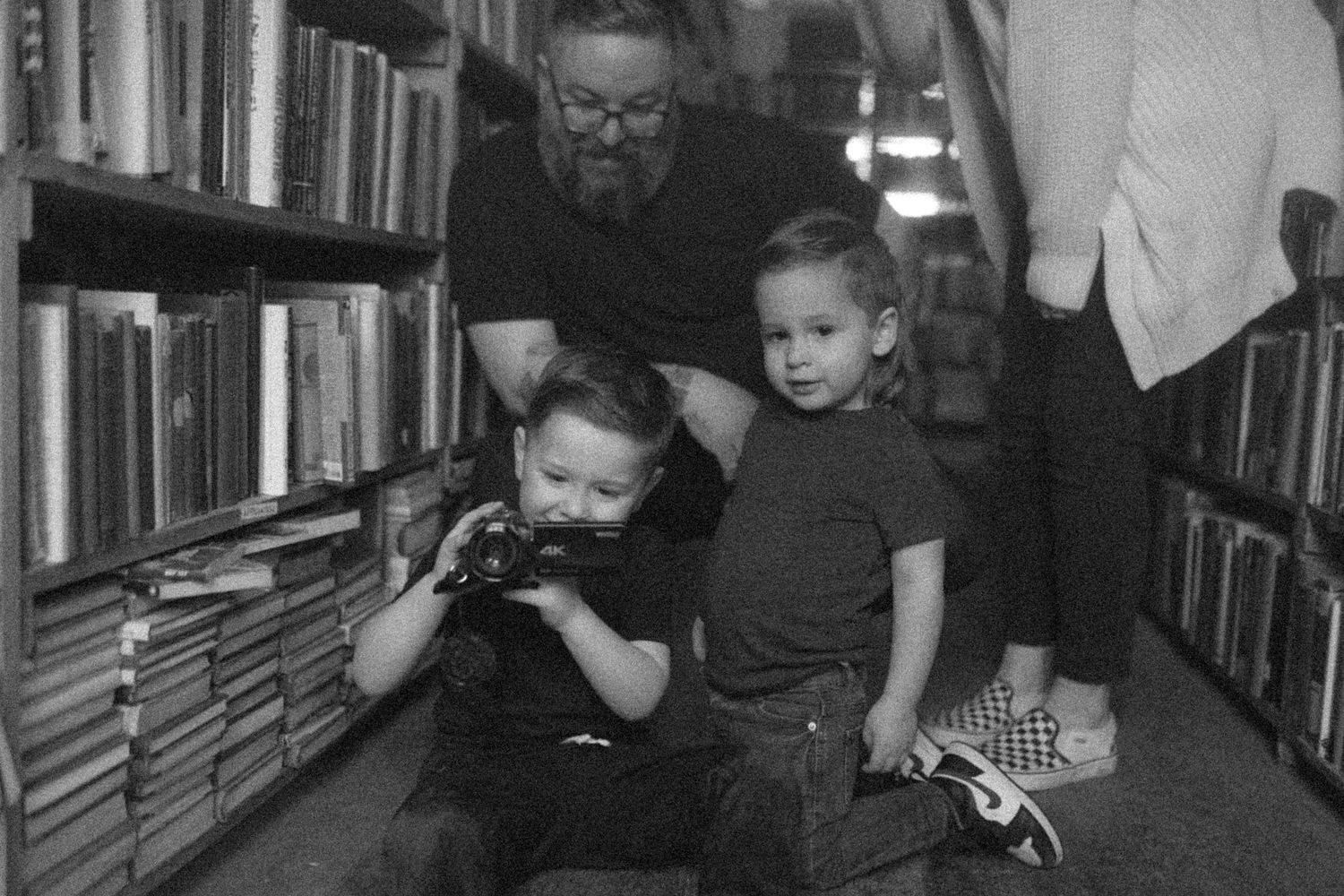 untraditional, unique family photos taken in a bookstore in downtown detroit