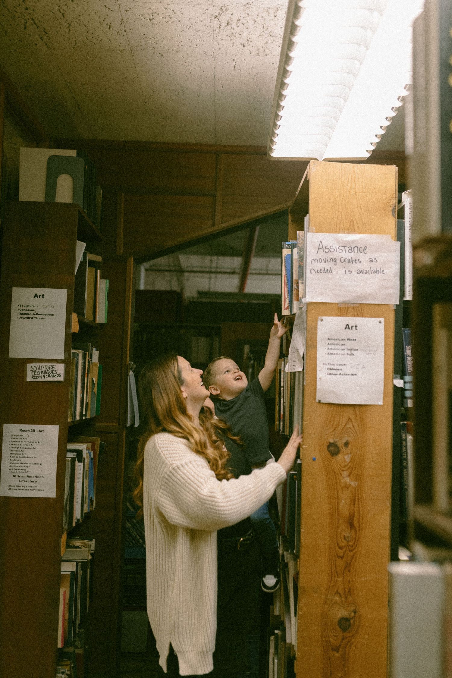 untraditional, unique family photos taken in a bookstore in downtown detroit