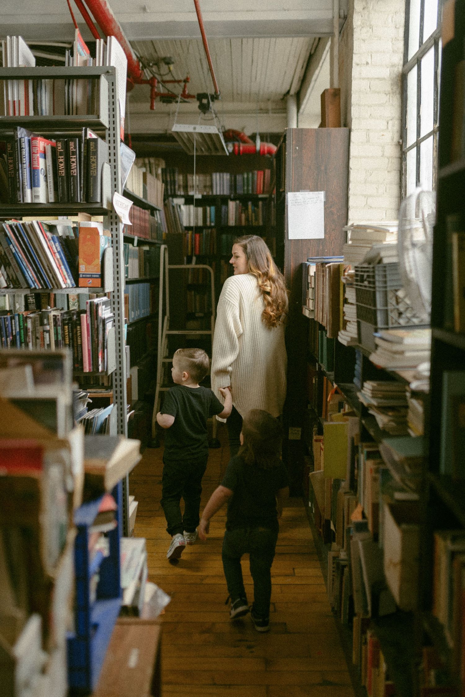 untraditional, unique family photos taken in a bookstore in downtown detroit