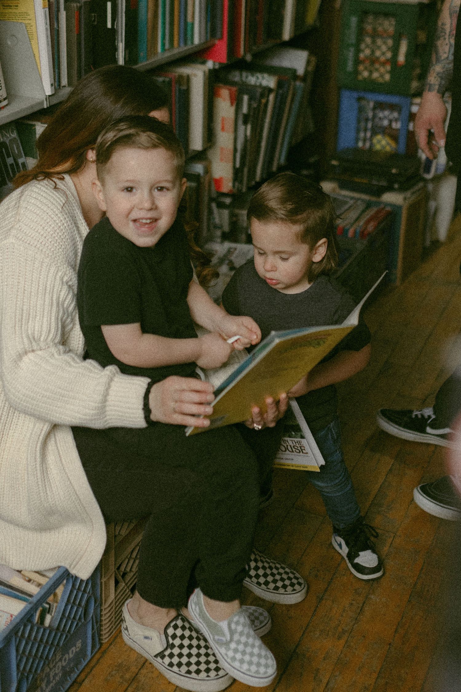 untraditional, unique family photos taken in a bookstore in downtown detroit