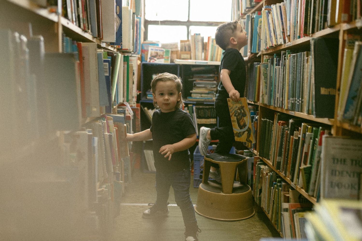 untraditional, unique family photos taken in a bookstore in downtown detroit