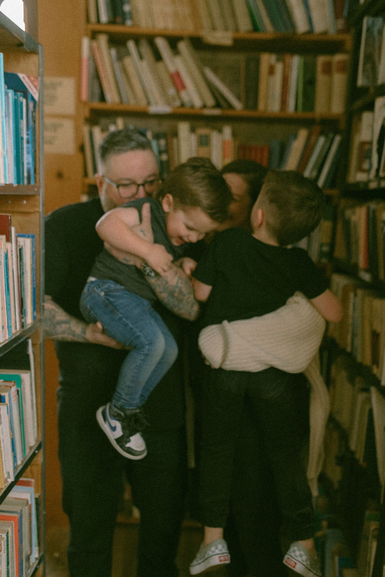 untraditional, unique family photos taken in a bookstore in downtown detroit