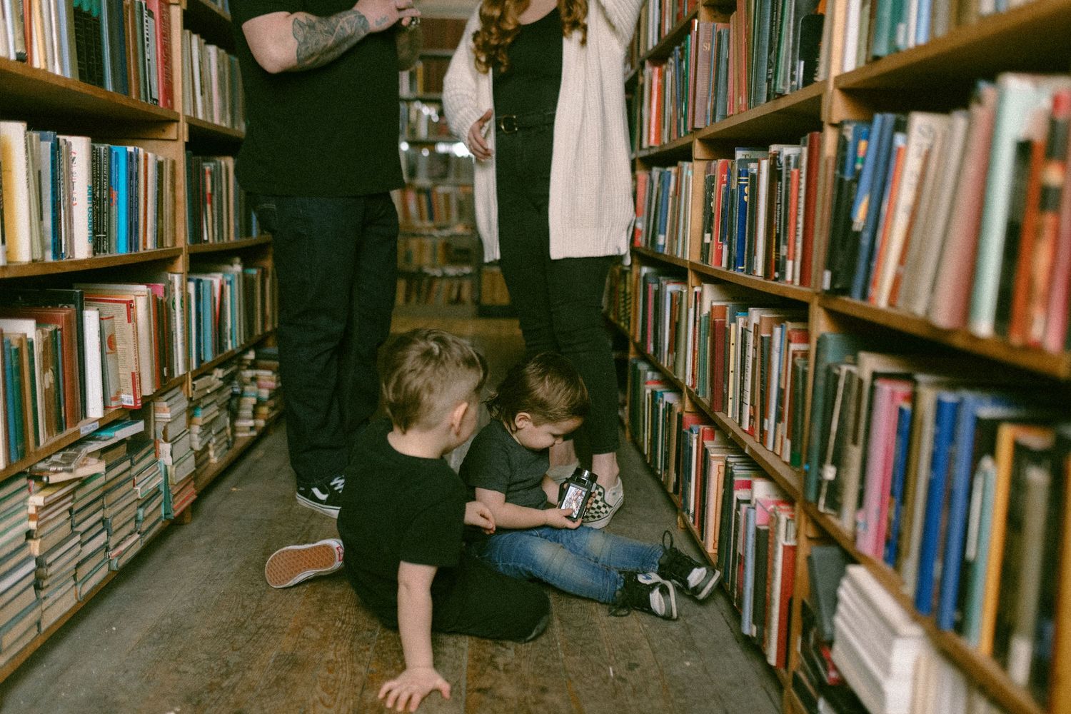 untraditional, unique family photos taken in a bookstore in downtown detroit