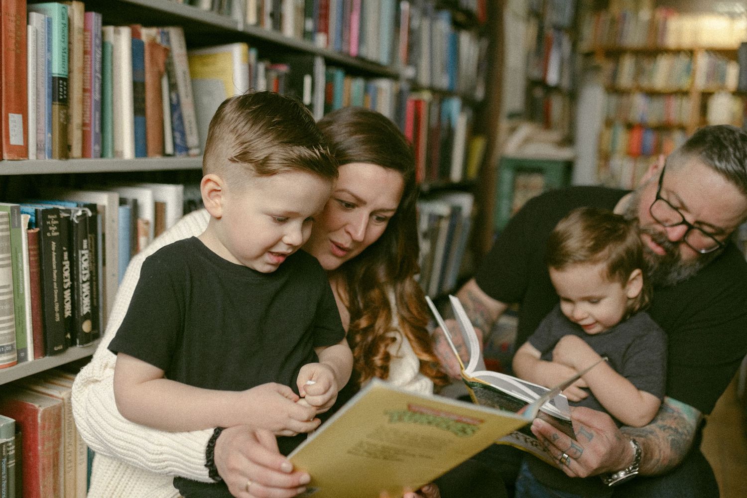 untraditional, unique family photos taken in a bookstore in downtown detroit