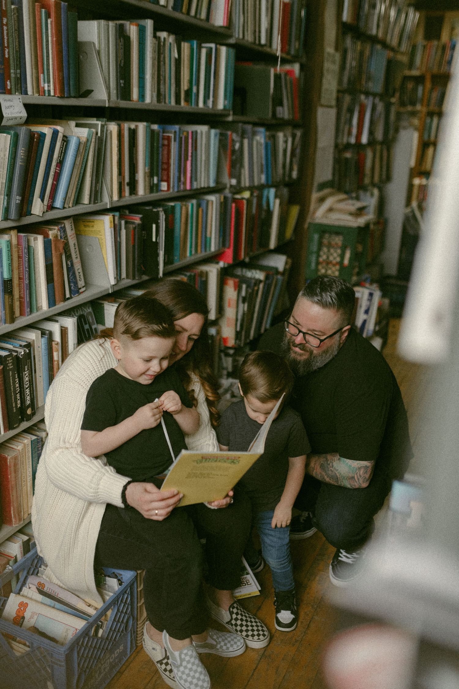 untraditional, unique family photos taken in a bookstore in downtown detroit