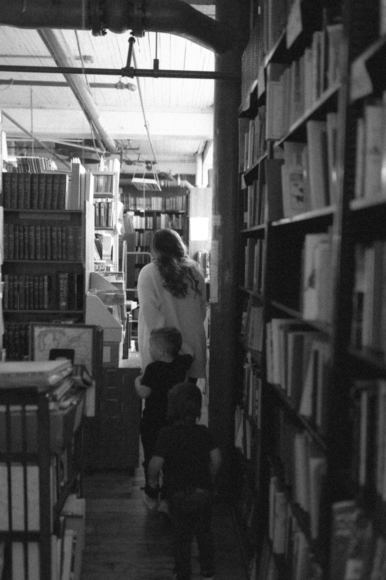 untraditional, unique family photos taken in a bookstore in downtown detroit