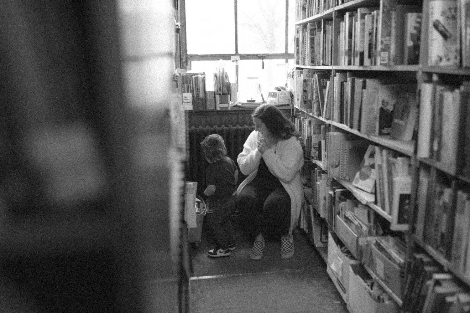 untraditional, unique family photos taken in a bookstore in downtown detroit