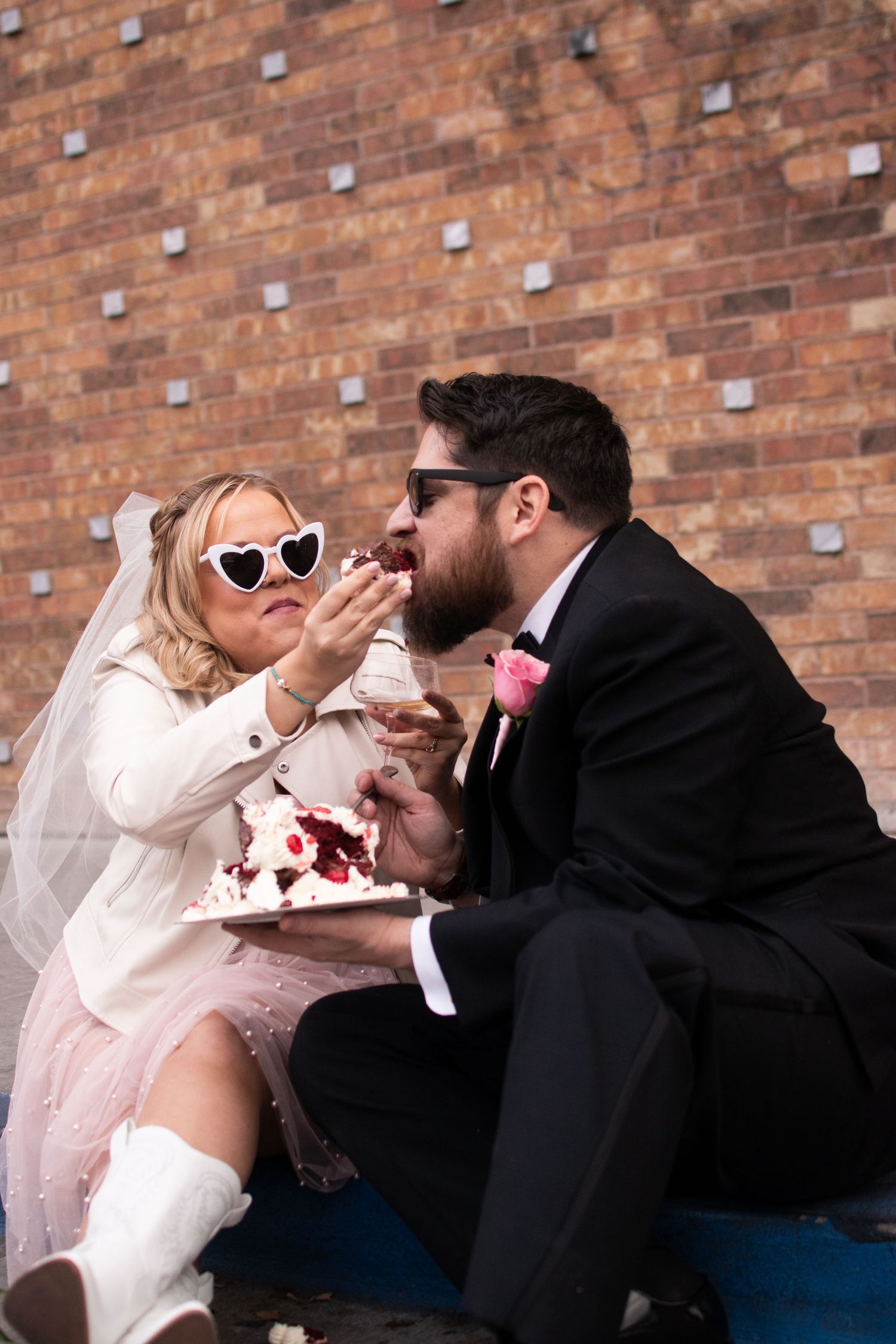 Feeding eachother wedding cake after a las vegas elopement at The Little White Chapel