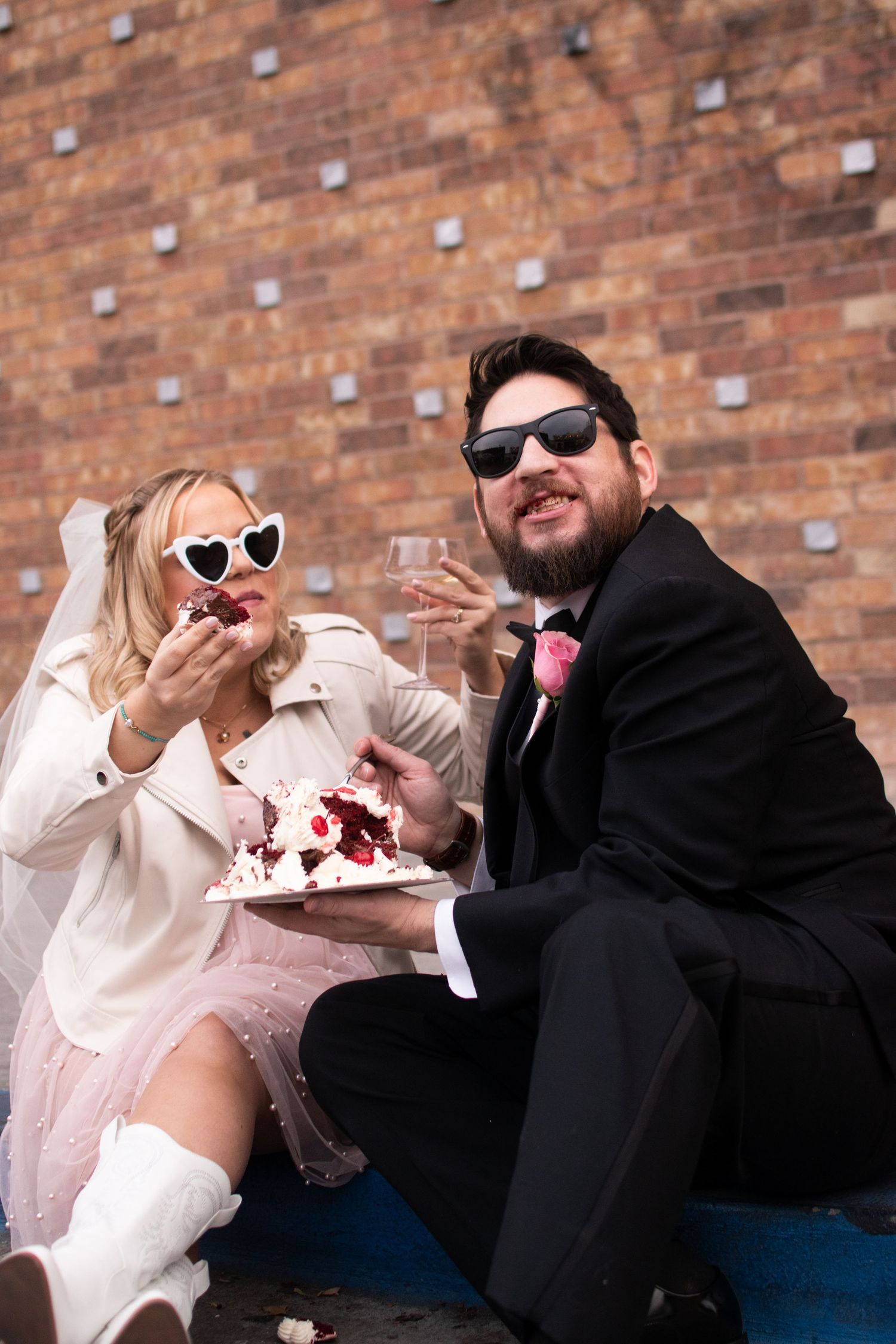 Smiling after being fed a bite of wedding cake after a las vegas elopement