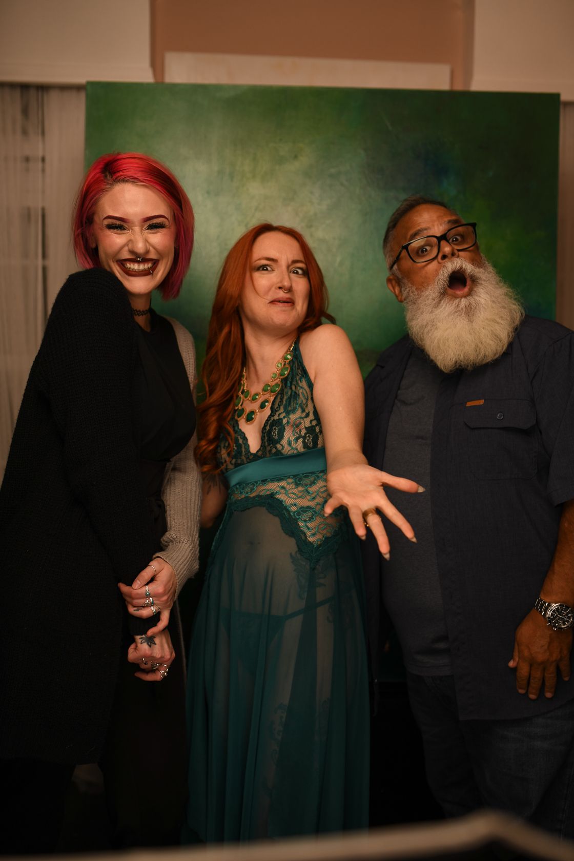 Three team member colleagues having a fun selfie and making faces.