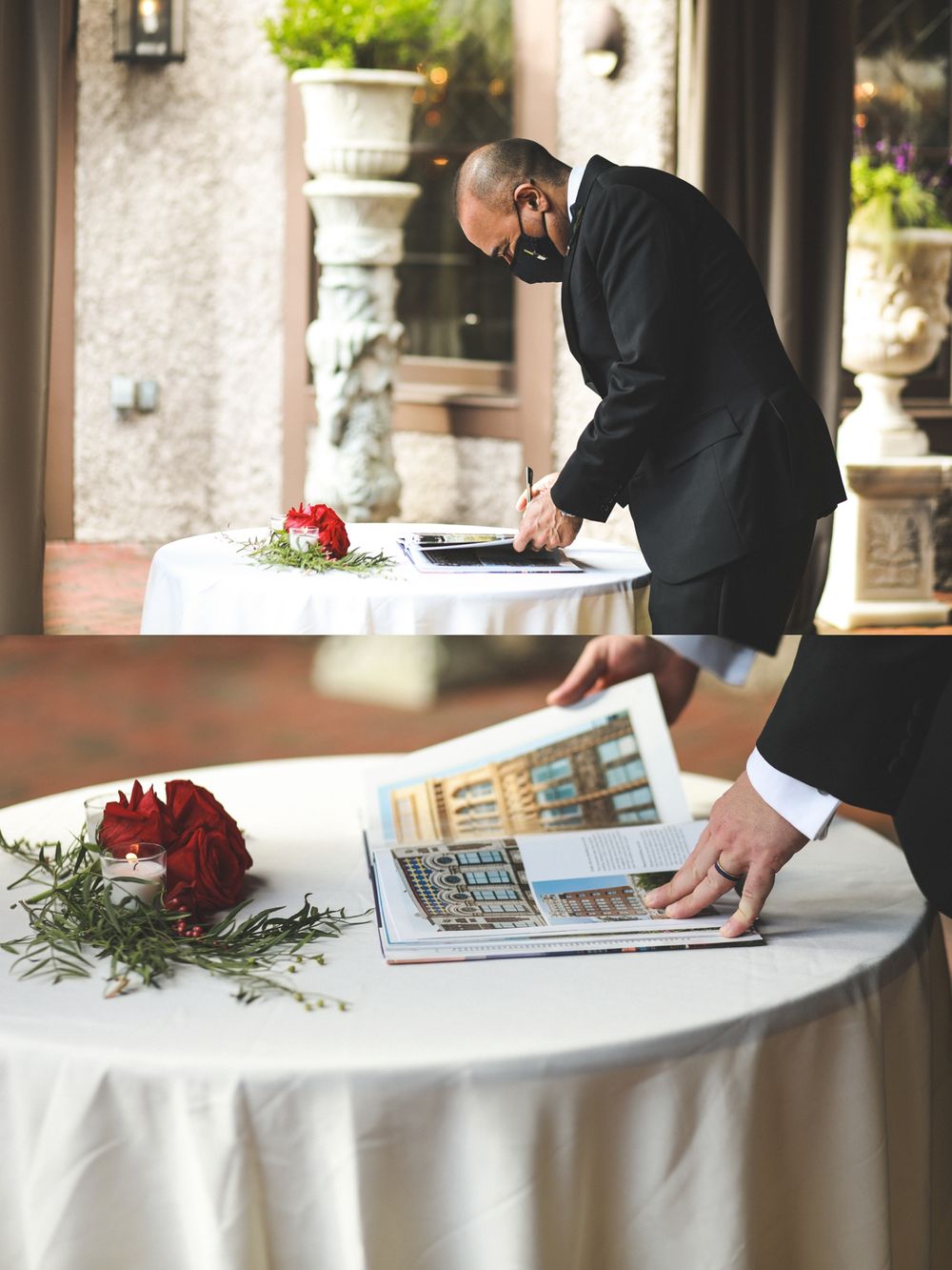 Event planner in suit working at table with laptop and floral arrangements.