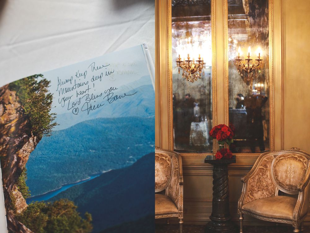 Scenic mountain postcard next to elegant interior with gold wall sconces.