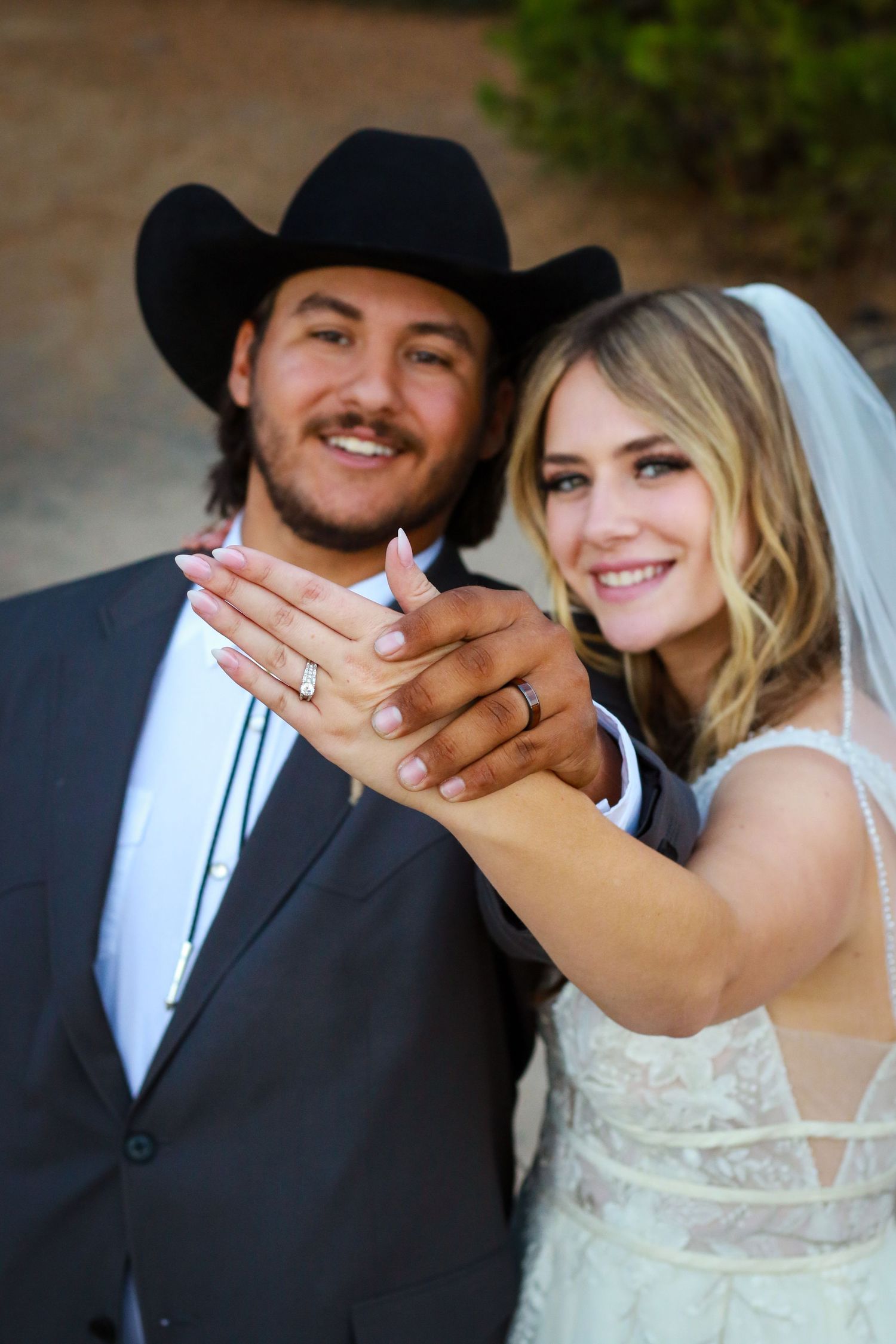 A series of wedding photos showing a couple in western attire displaying an engagement ring.