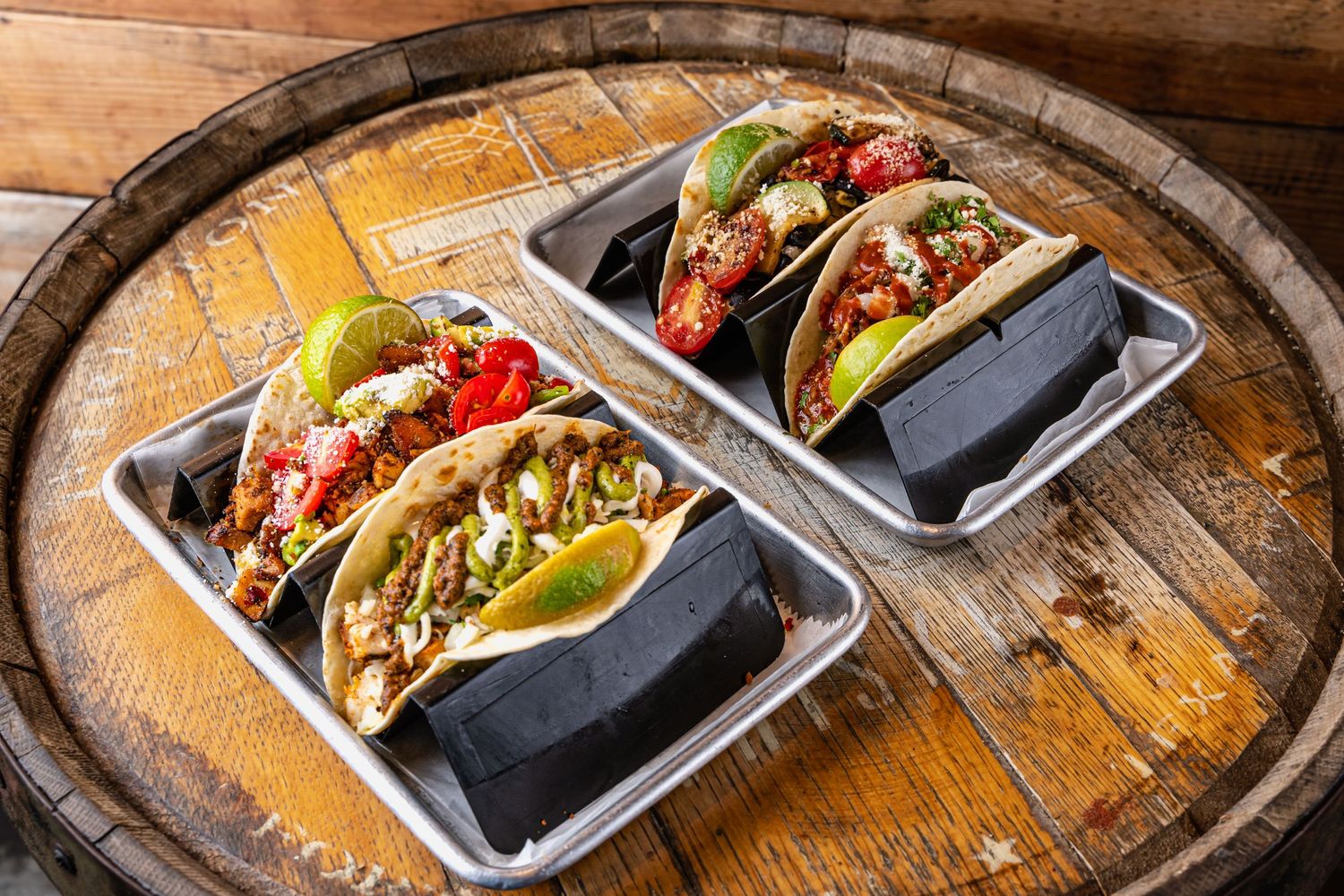 Cartel Tacos Four tacos on a barrel