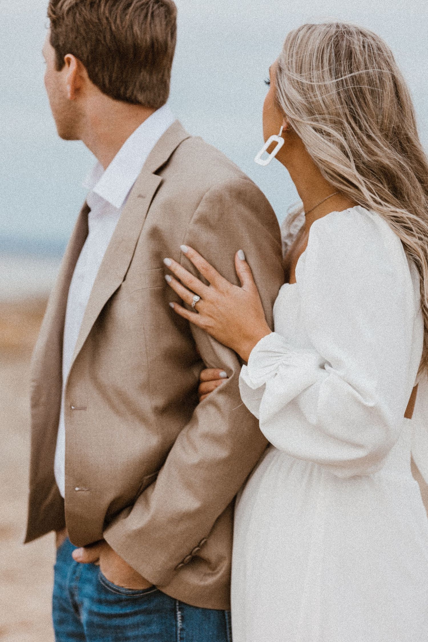 Close-up series of couple in tan blazer and white top sharing tender moments.