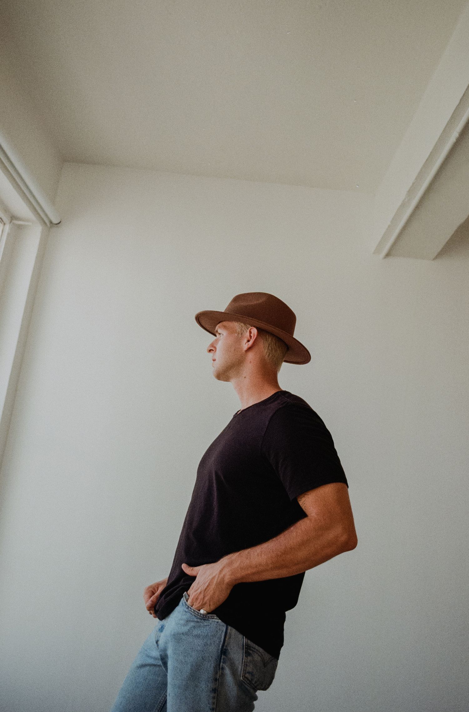 Studio photo of man in hat in downtown Los Angeles