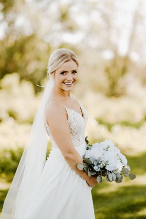A bride poses on her wedding day