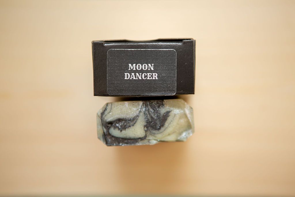 Black Moon Dancer soap box with marbled gray and white artisanal soap bar.