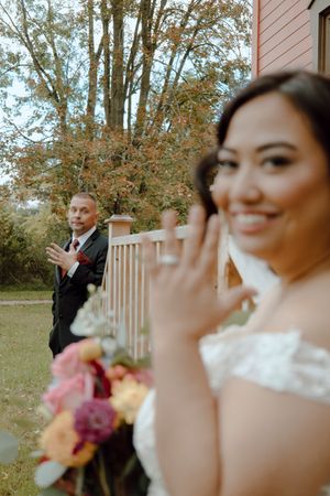 Groom and Bride shows off their wedding rings