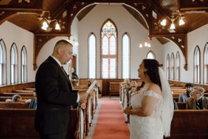 Groom and Bride saying their vows at the altar
