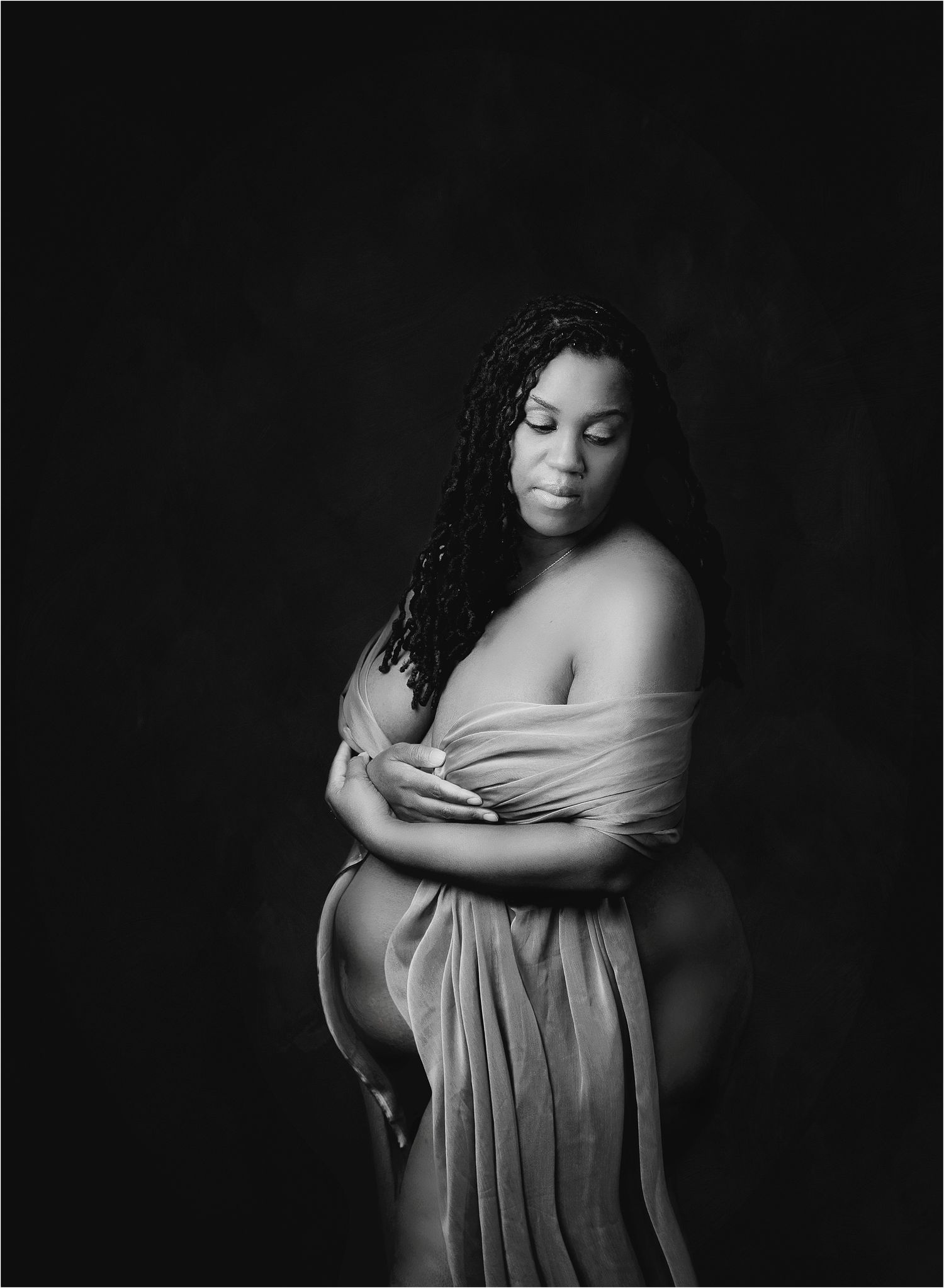 Fabric draped black and white portrait of pregnant black mom captured by Ausitn Maternity PHotographer V. Steinkoenig