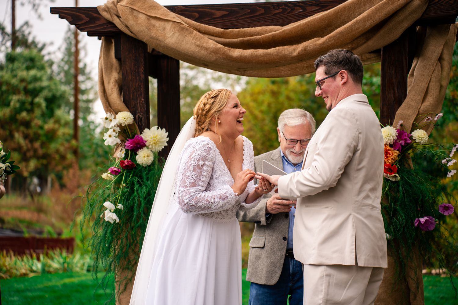 bride and groom laugh together