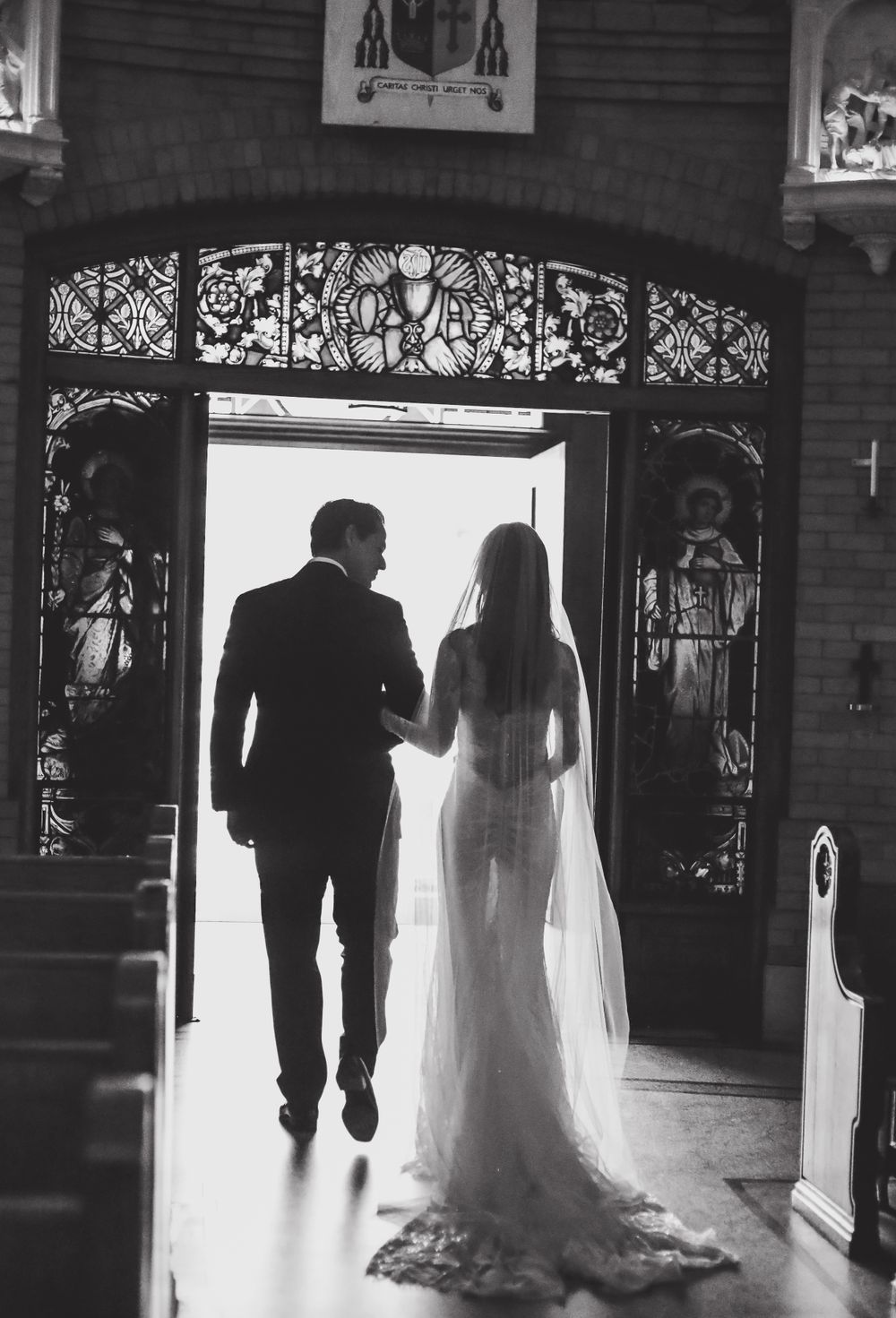 Bride and Groom walking in Basillica Wedding in Asheville