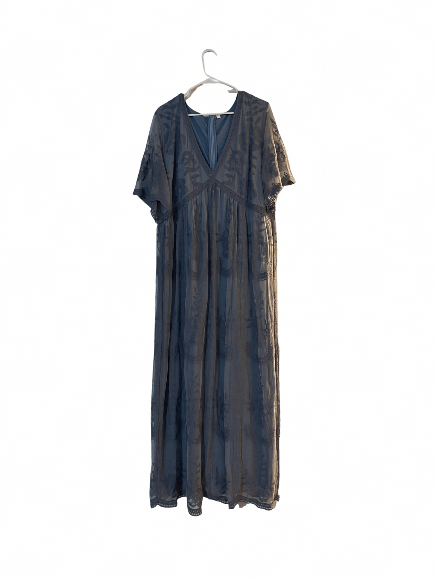 Navy blue short-sleeve dress hanging on white hanger against plain background.