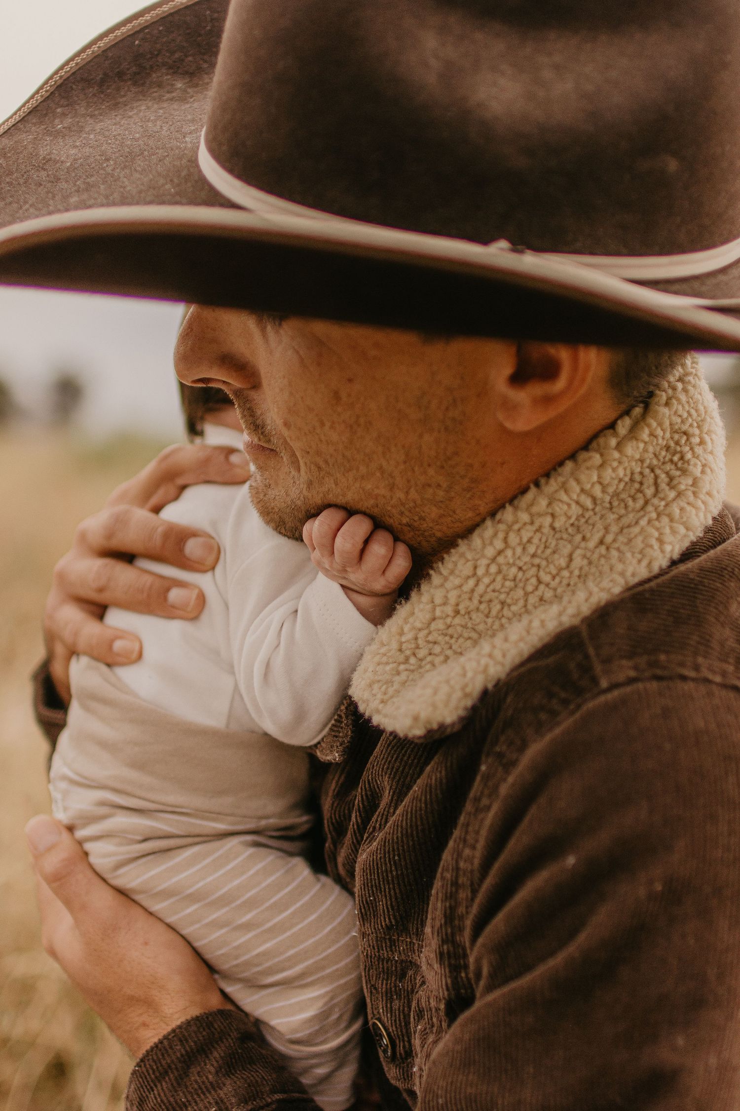 Little hands on Dads face