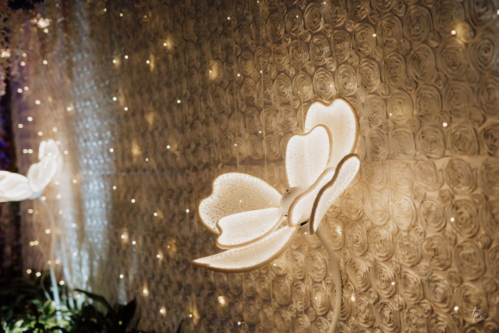 Elegant wall decor featuring illuminated butterfly motifs creating a romantic ambiance.