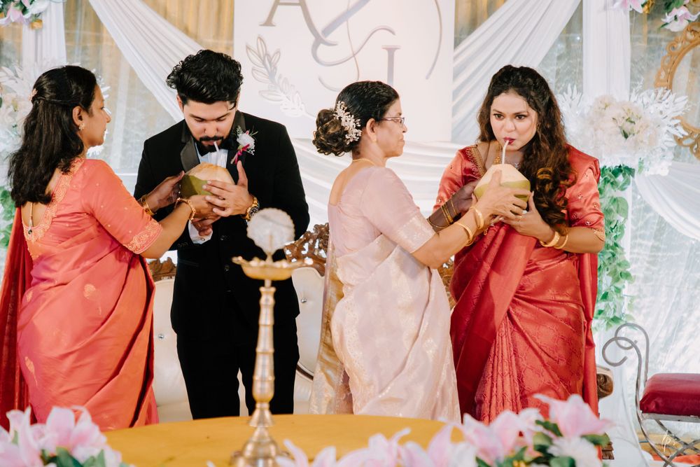 Wedding party members sharing drinks and toasting during a celebration.