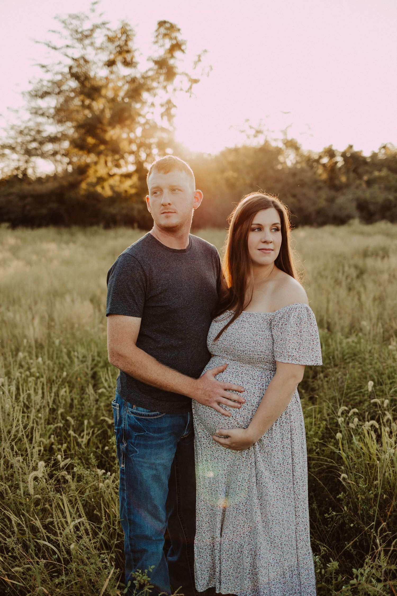 mom and dad dream of baby during field maternity session