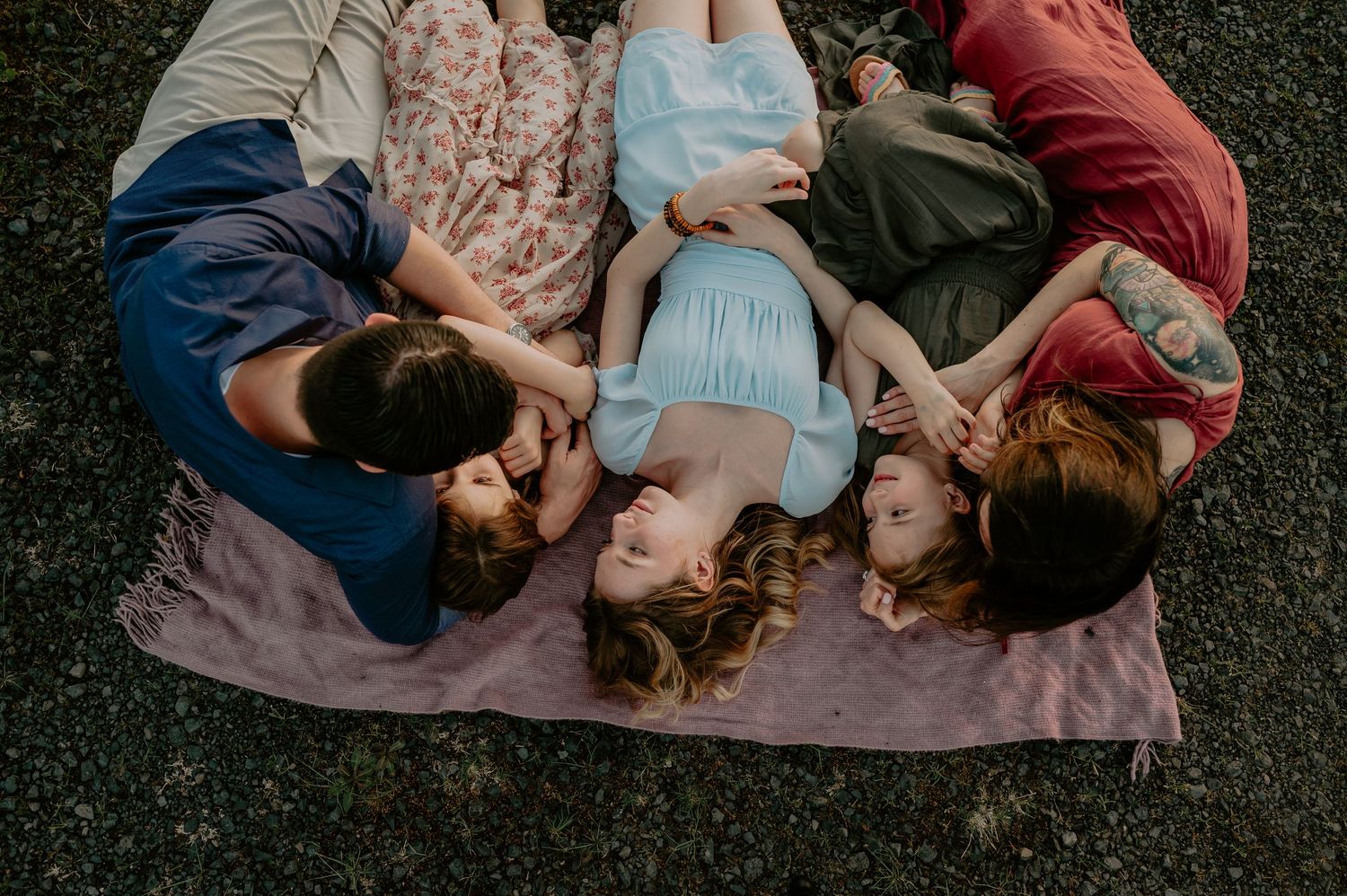 Family laying in a field