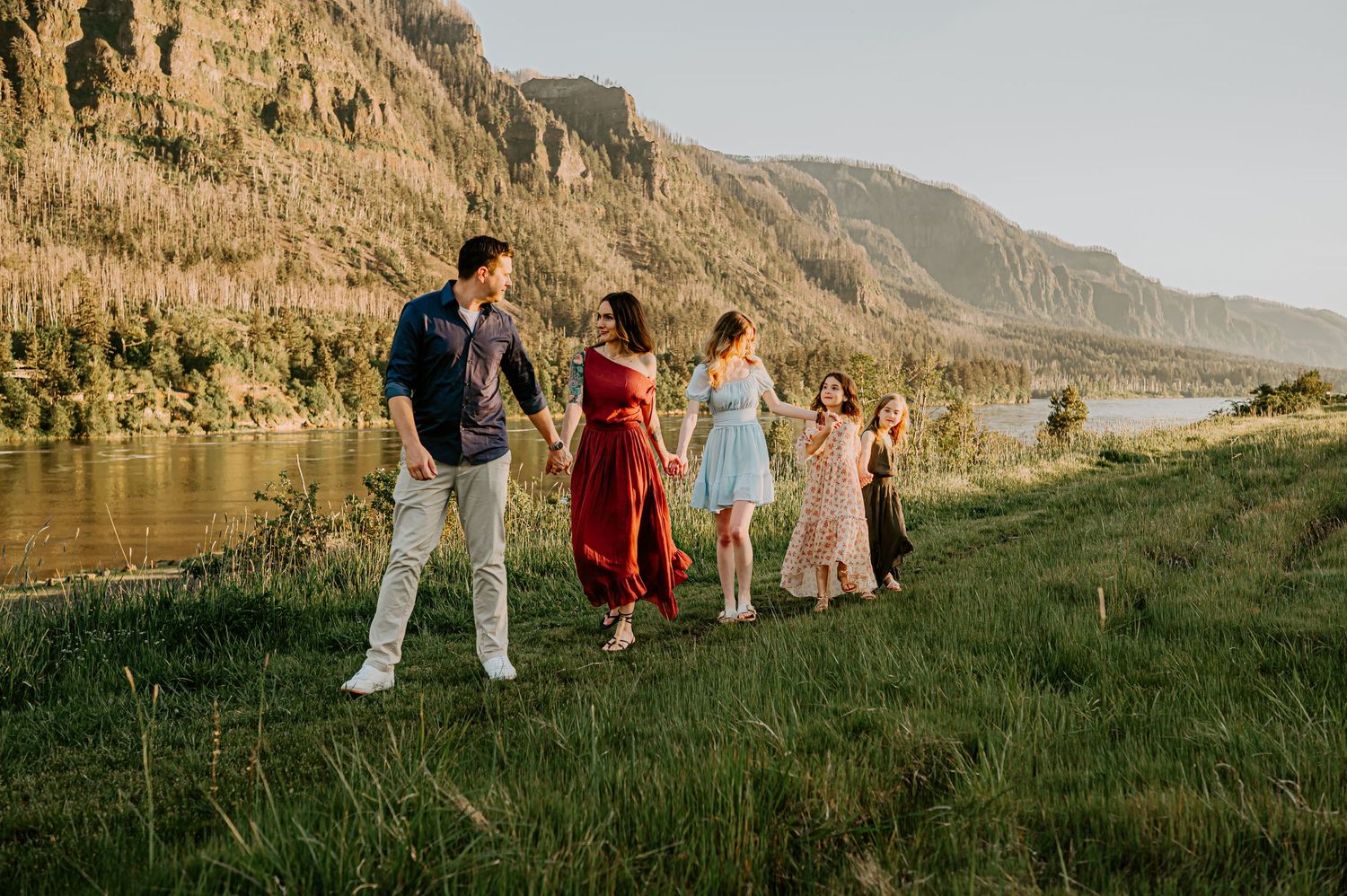 Family walks by a river