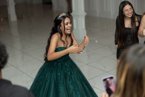 An excited reaction during a celebratory dance at an indoor party.