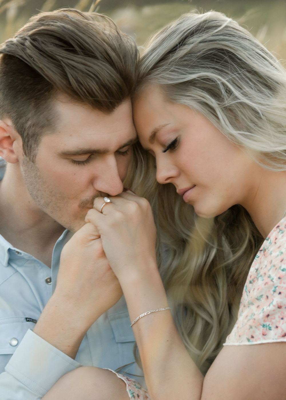 Intimate romantic couple embracing while sharing tender moment outdoors. Engagement Photographer Batavia Cincinnati Ohio