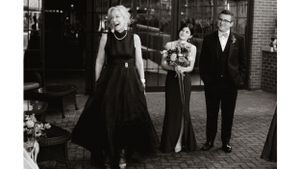 A vintage black and white photograph of guests at a formal evening event.