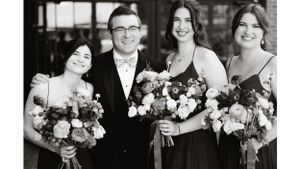 Wedding party members pose with colorful flower bouquets in formal attire.