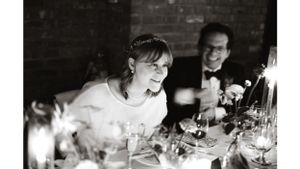 Candlelit reception scene showing guests enjoying a festive dinner celebration.