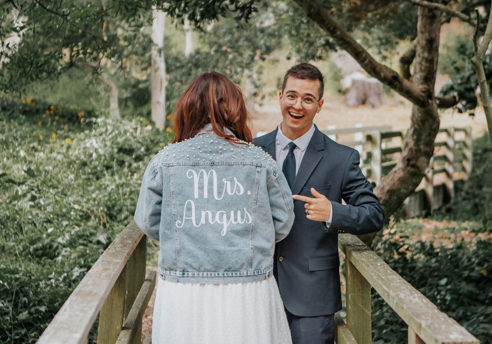 Wedding photos featuring denim jackets with custom text in an outdoor garden setting.