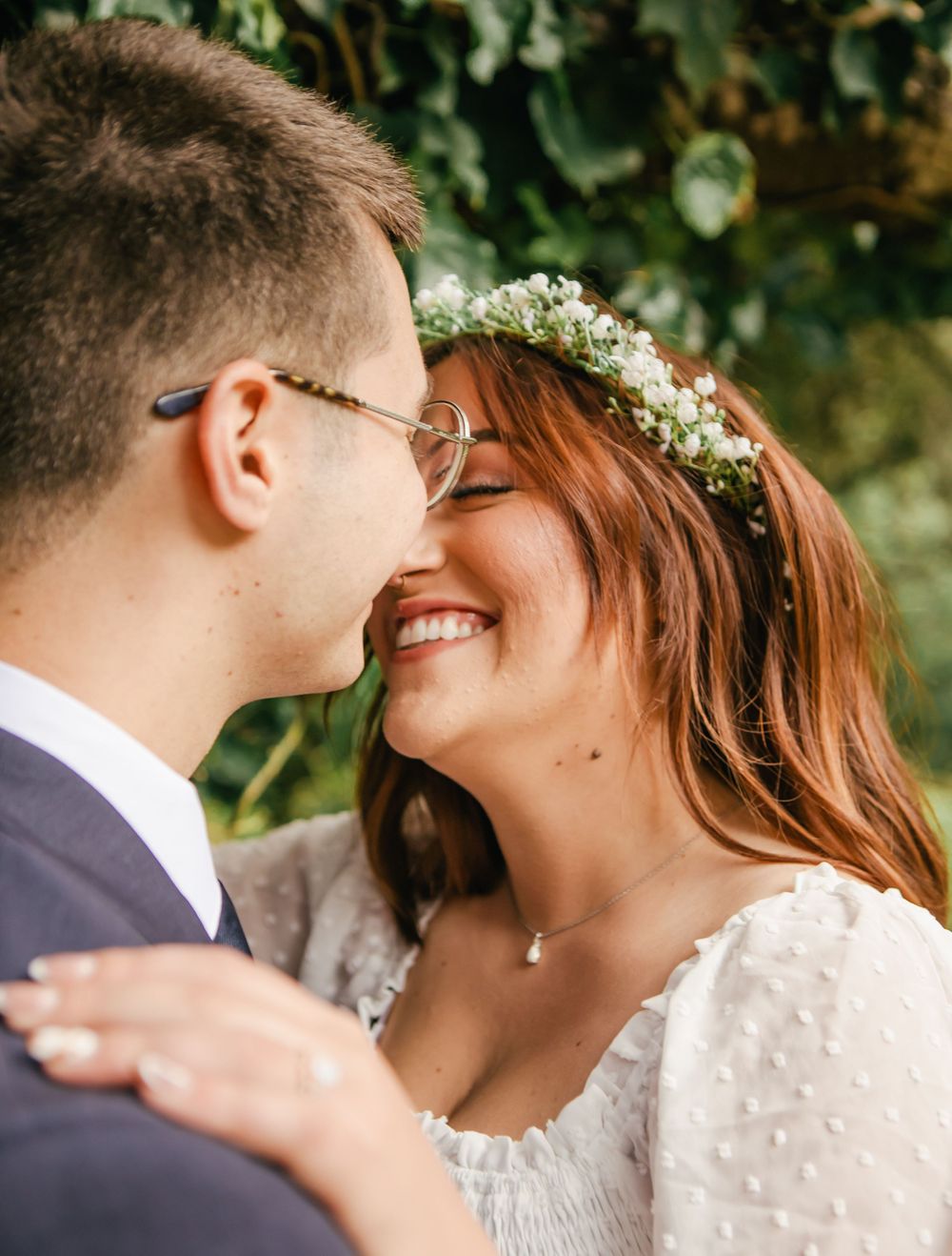 Intimate close-up shots of a couple sharing romantic moments in a garden setting.