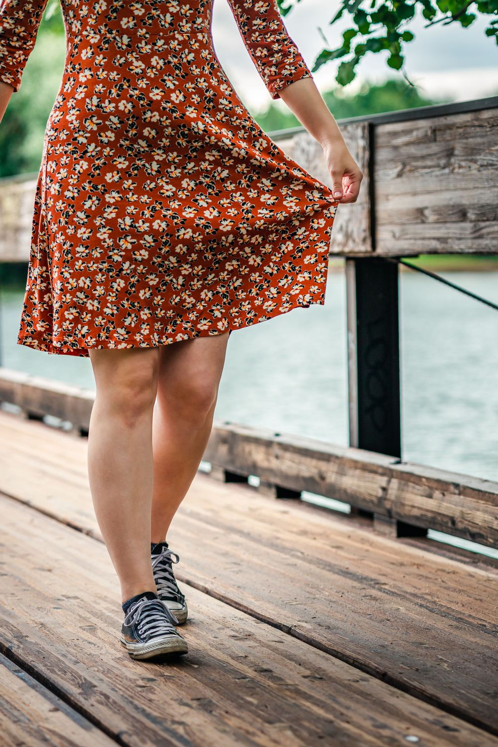 Woman walking wearing a red dress
