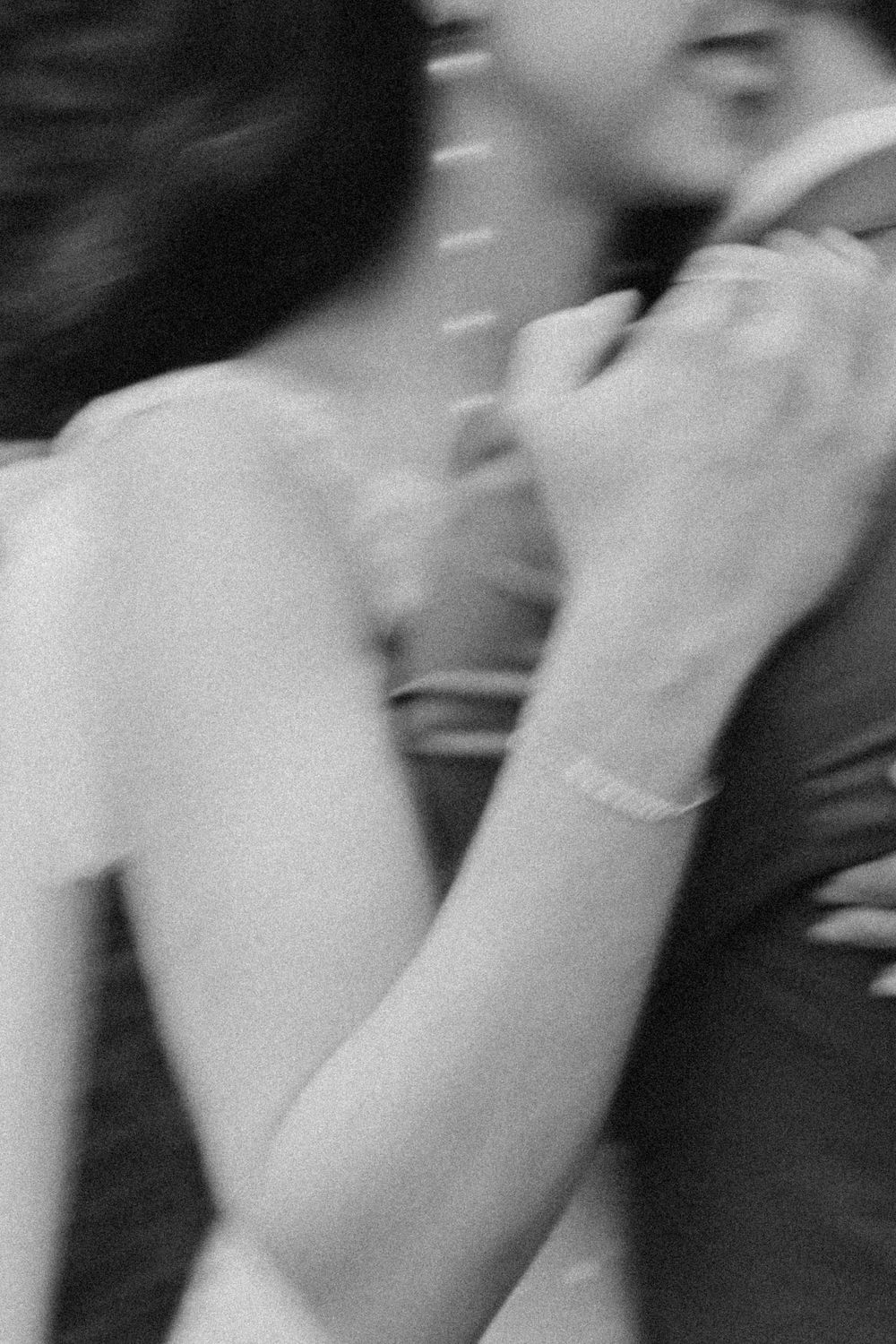 Artistic black and white close-up of delicate wedding day preparations.