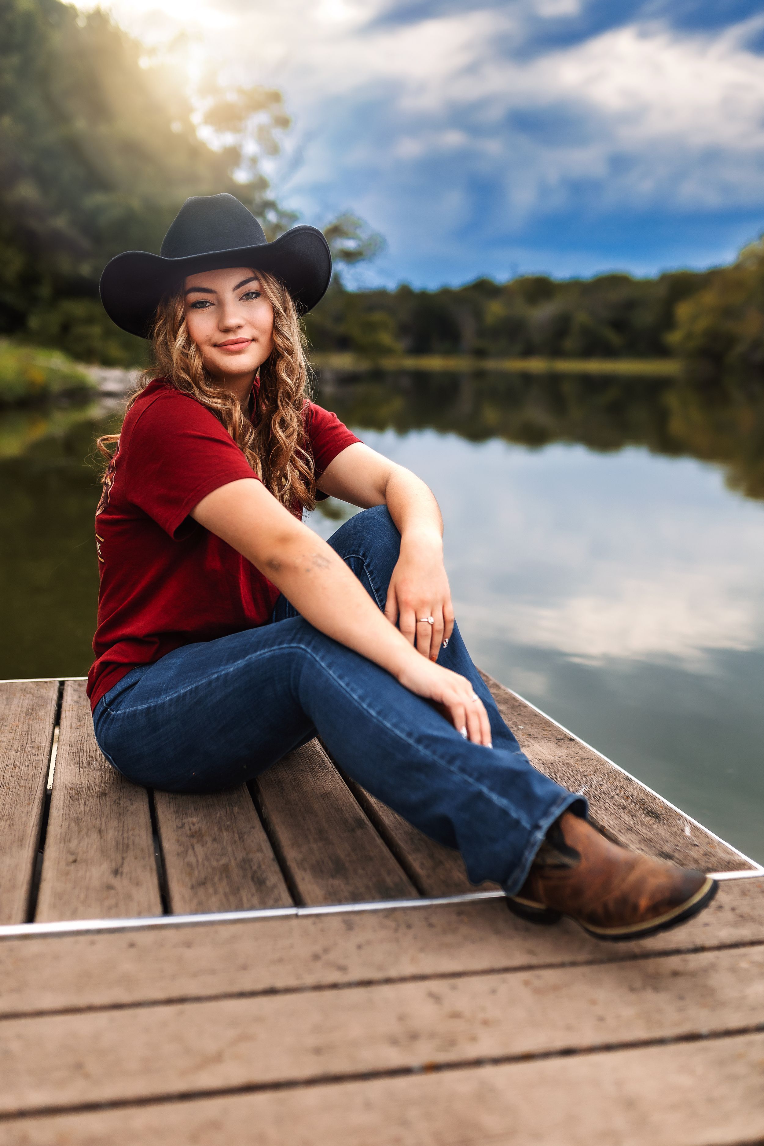 A western-inspired portrait on a dock with a lake and forest backdrop at golden hour.
Janesville, WI
Brodhead, WI